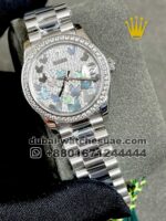 The Rolex Date just 31 mm White Gold Diamond Pave Mother of Pearl Stoned Bezel Stainless Steel.