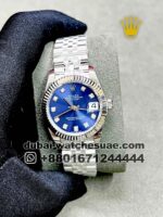 Rolex 31 mm Ladies Blue Dial with silver flutted bezel