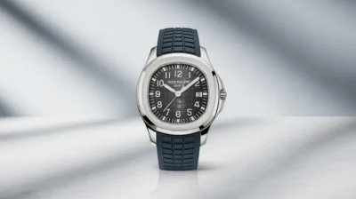 Patek Philippe Aquanaut 5067 watch in stainless steel, highlighting its clean design and refined tropical strap, set in a minimalist background.